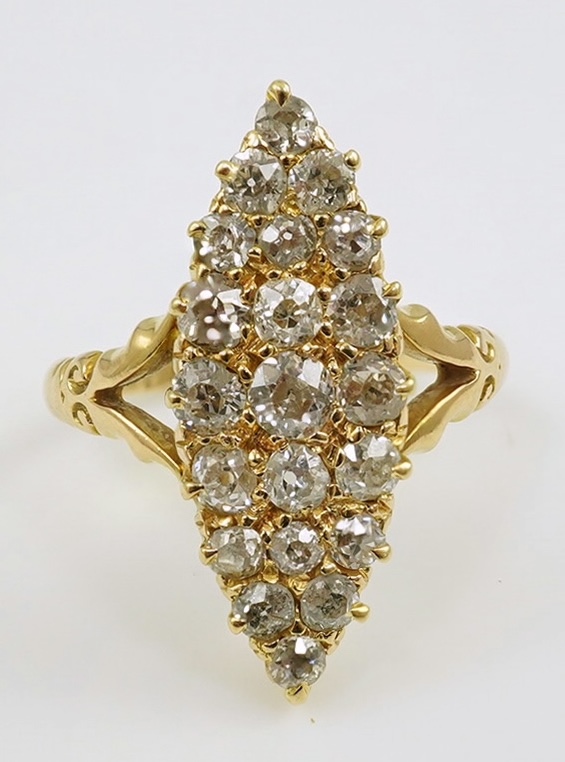 An early 20th century gold and diamond cluster set marquise shaped ring